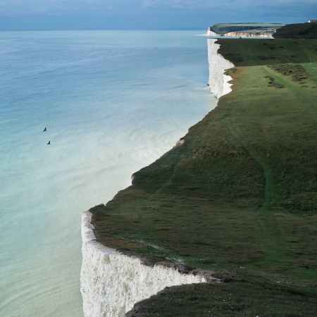 green grass field in coastal plateau
